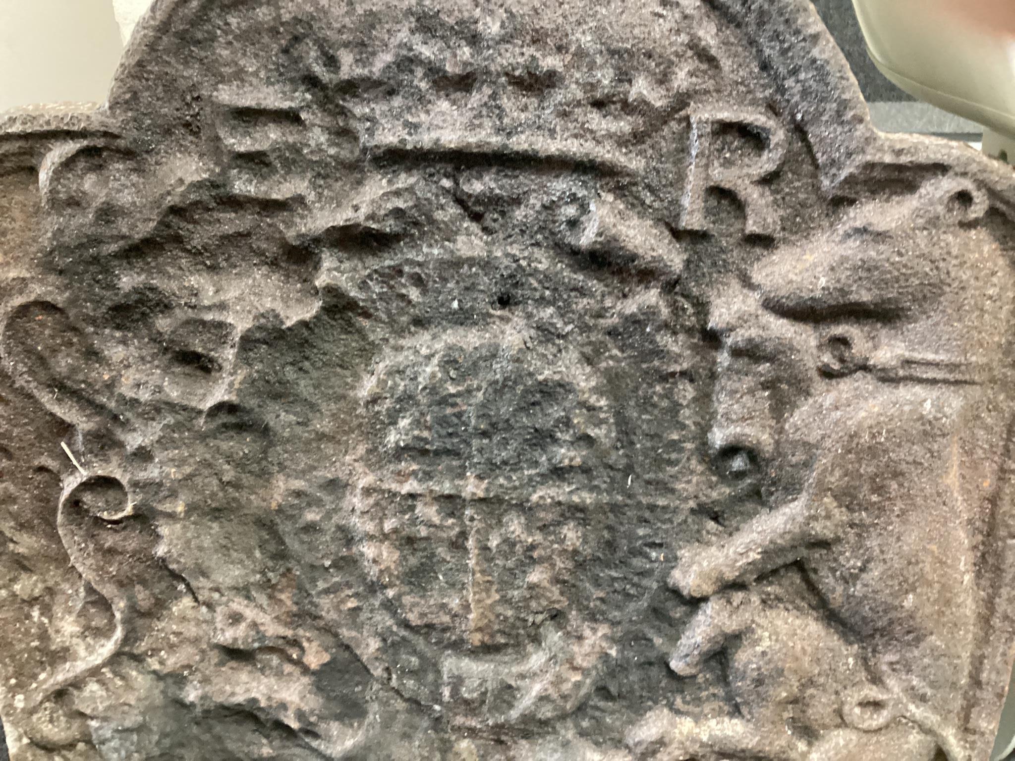 A Tudor cast iron fire back, believed to be Edward VI coat of arms and cast by John Harvo, width 62cm height 75cm.